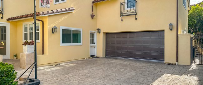 Exterior view of a third car garage that has been converted into an additional bedroom and bathroom.