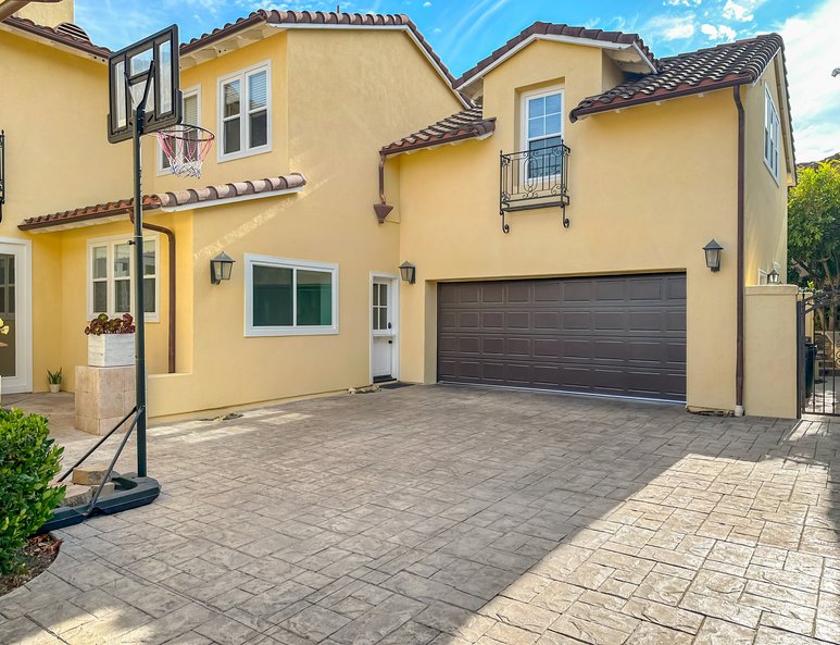 Exterior view of a third car garage that has been converted into an additional bedroom and bathroom.