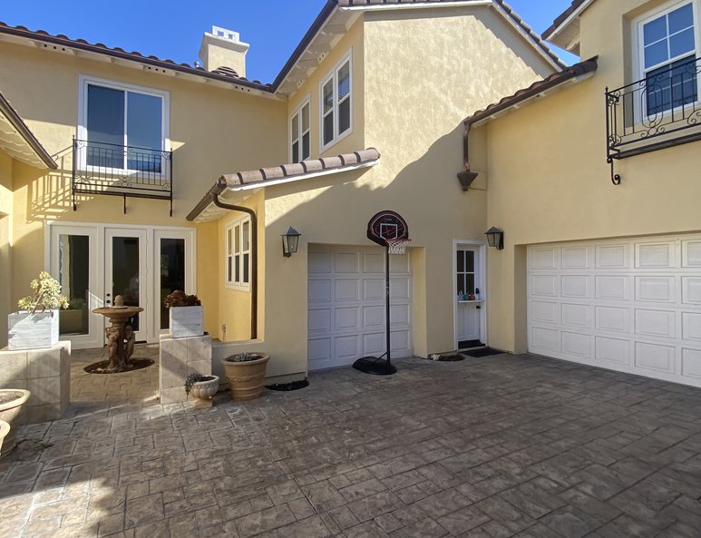 Exterior Image of a third car garage before it has been converted into an additional bedroom and bathroom.