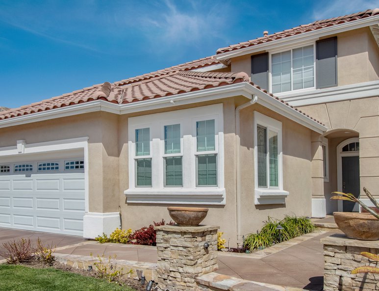 Exterior view of an Irvine home after its third car garage was convered into additional indoor living space.